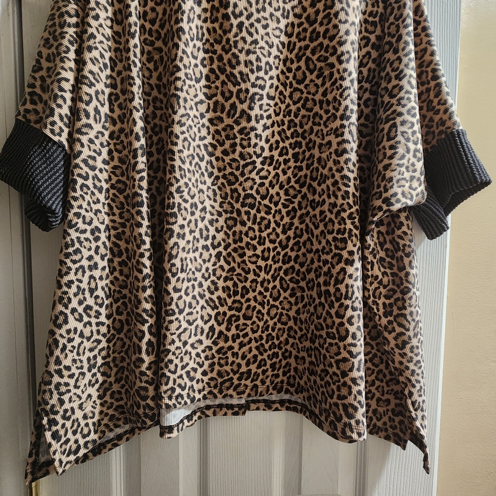 Chic Leopard Print Blouse with Black Trim